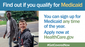 Blue banner, "find out if you qualify for Medicaid" and white square "you can sign up for Medicaid anytime of the year... apply now at HealthCare.gov next to a picture of two men, one with dark black skin and the other white wheelchair user walking on the sidewalk.