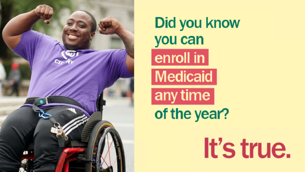 A young man using a wheelchair smiles at the camera with both arms flexed above his head with message "Did you know you can enroll in Medicaid any time of the year? It's True."