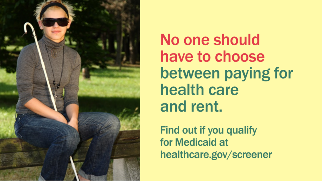 A young woman with sunglasses sits on a park bench with a guide cane with message "No one should have to choose between paying for health care and rent."